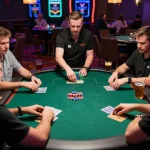 Players engaging in an intense poker game at VK88 casino, showcasing strategic gameplay and vibrant atmosphere.