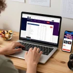 BOM88 user actively placing bets on a laptop, showcasing online sports betting strategies.